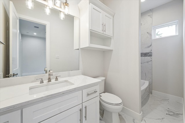 bathroom with marble finish floor, shower / bathing tub combination, toilet, vanity, and baseboards