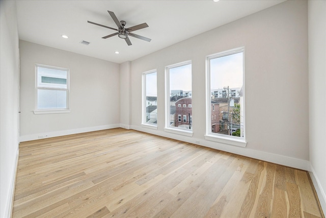 spare room with a ceiling fan, recessed lighting, baseboards, and wood finished floors