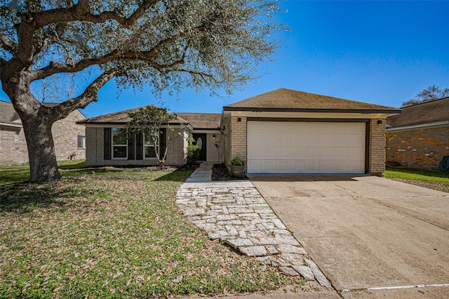 view of front of property featuring brick siding, an attached garage, concrete driveway, and a front lawn