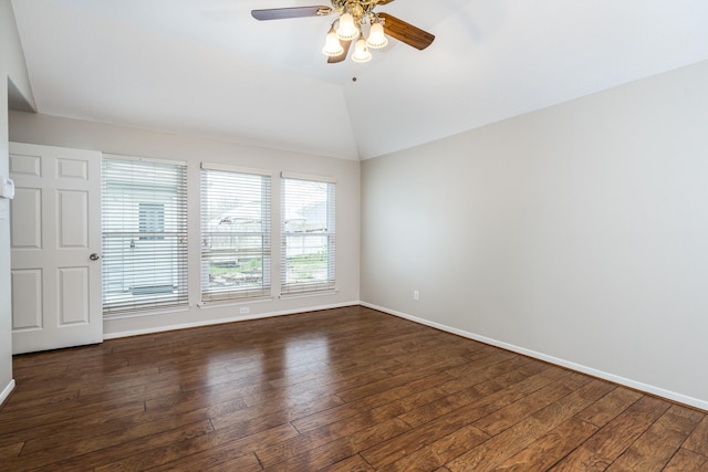 empty room featuring baseboards, lofted ceiling, ceiling fan, and hardwood / wood-style flooring