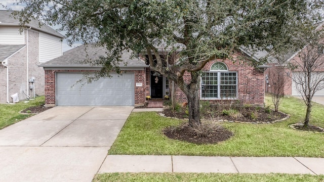 ranch-style house with a front yard, a garage, brick siding, and concrete driveway