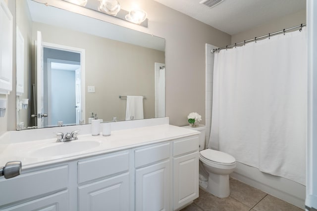 full bathroom featuring visible vents, toilet, tile patterned floors, vanity, and shower / bathtub combination with curtain