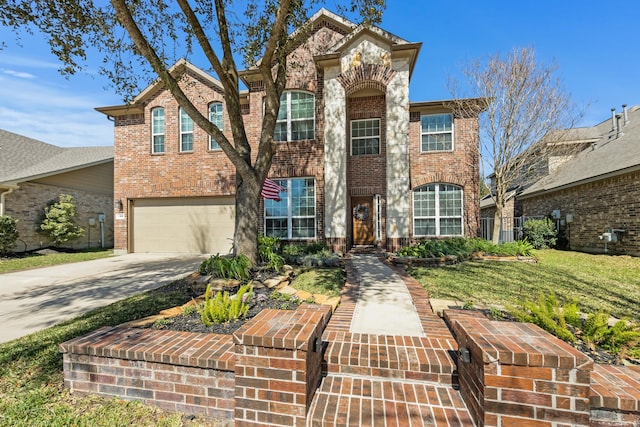 view of front of house featuring brick siding, concrete driveway, a front yard, fence, and a garage