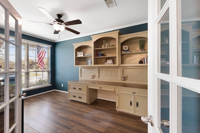 office featuring french doors, crown molding, built in desk, visible vents, and dark wood-type flooring