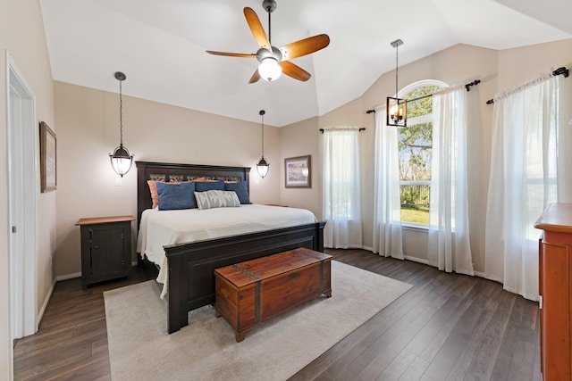 bedroom with dark wood-style floors, ceiling fan, lofted ceiling, and baseboards