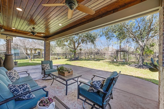 view of patio with ceiling fan, outdoor lounge area, and a fenced backyard