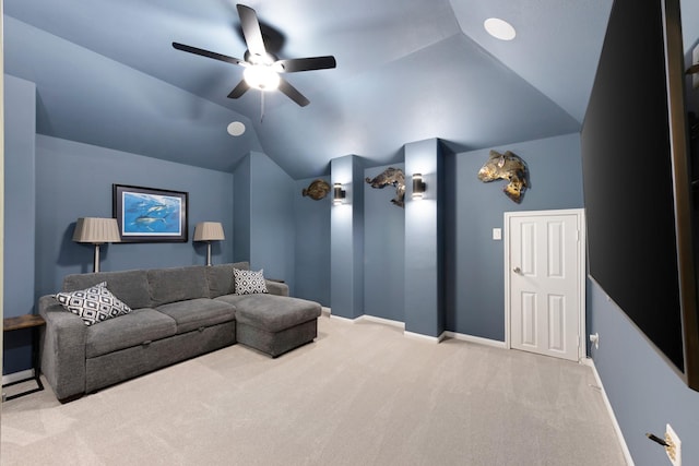 home theater room with carpet, vaulted ceiling, baseboards, and ceiling fan