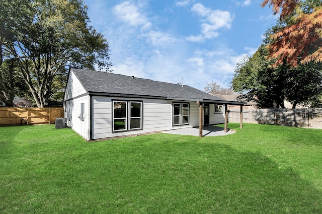 back of property with a patio, a lawn, a fenced backyard, and central air condition unit