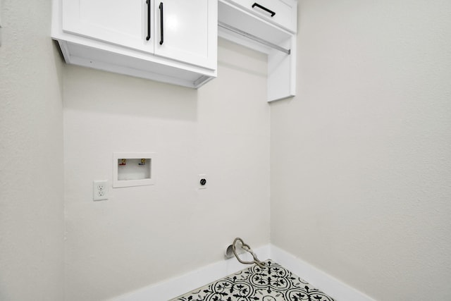 clothes washing area featuring cabinet space, hookup for a washing machine, baseboards, and hookup for an electric dryer