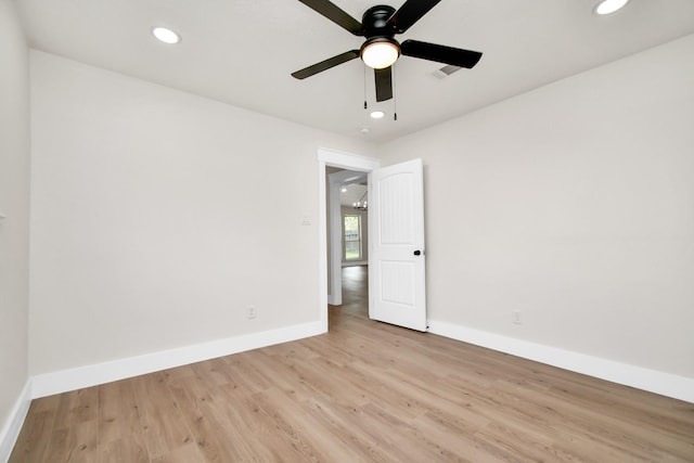 spare room featuring baseboards, ceiling fan, recessed lighting, and light wood-style floors