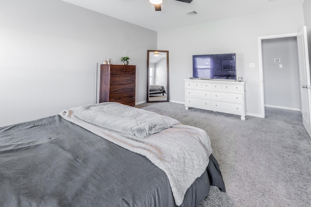 carpeted bedroom featuring baseboards, visible vents, and ceiling fan