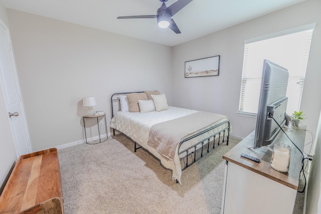 bedroom featuring baseboards and a ceiling fan