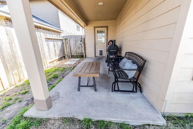 view of patio featuring fence