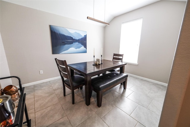 dining area with light tile patterned floors and baseboards