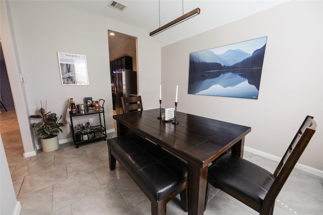 dining room featuring visible vents, baseboards, and light tile patterned floors