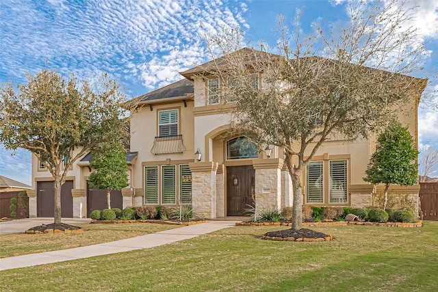 view of front of house featuring concrete driveway, an attached garage, fence, stone siding, and a front lawn