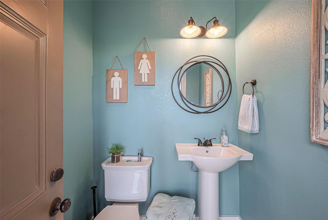 bathroom featuring a sink and toilet