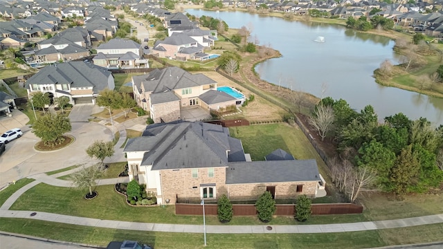 aerial view featuring a water view and a residential view