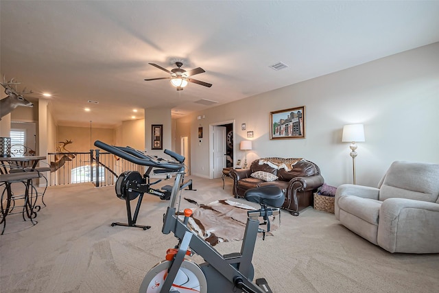 workout area with a ceiling fan, visible vents, and carpet flooring