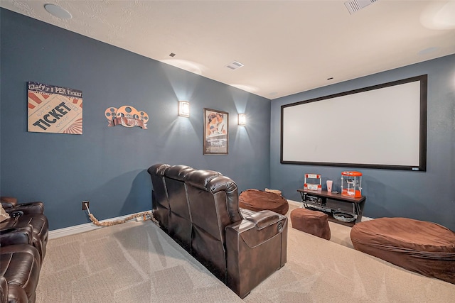 home theater room with carpet flooring, visible vents, and baseboards