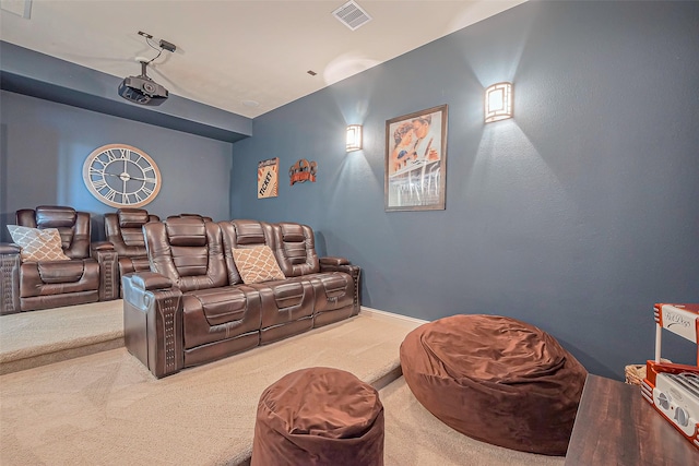 carpeted cinema featuring visible vents and baseboards