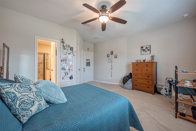 bedroom featuring light colored carpet, visible vents, connected bathroom, vaulted ceiling, and ceiling fan