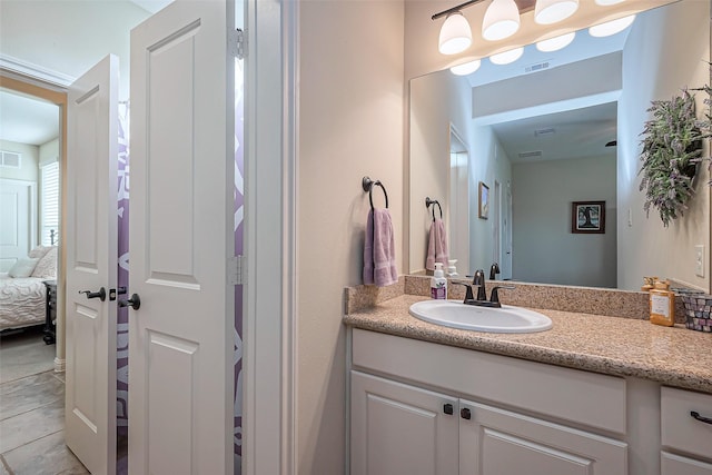 ensuite bathroom with visible vents, ensuite bathroom, and vanity