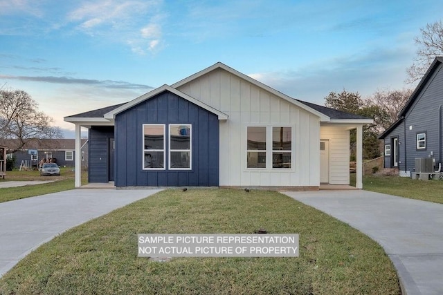 view of front facade featuring a front yard, central AC unit, and board and batten siding