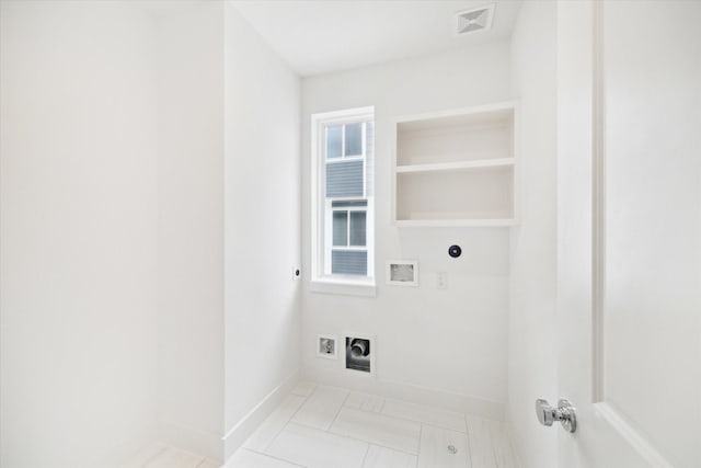 washroom with hookup for a washing machine, hookup for an electric dryer, laundry area, visible vents, and baseboards