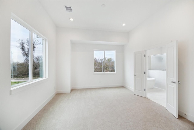 unfurnished bedroom with baseboards, recessed lighting, visible vents, and light colored carpet