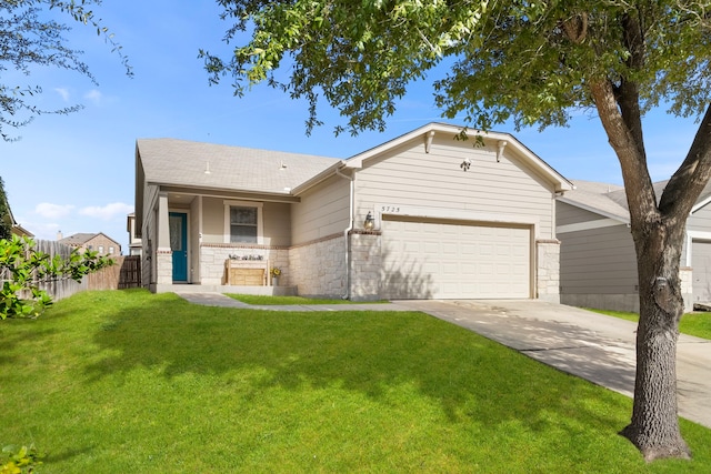 single story home with driveway, stone siding, an attached garage, fence, and a front lawn