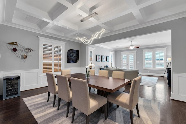 dining area featuring wine cooler, crown molding, dark wood finished floors, coffered ceiling, and beamed ceiling