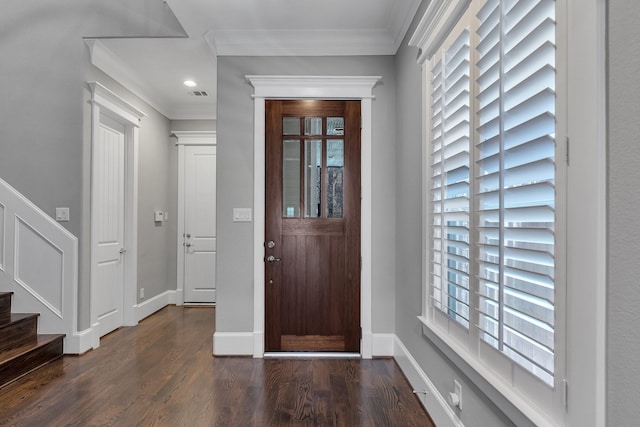 entrance foyer with a wealth of natural light, ornamental molding, dark wood-style flooring, and stairway