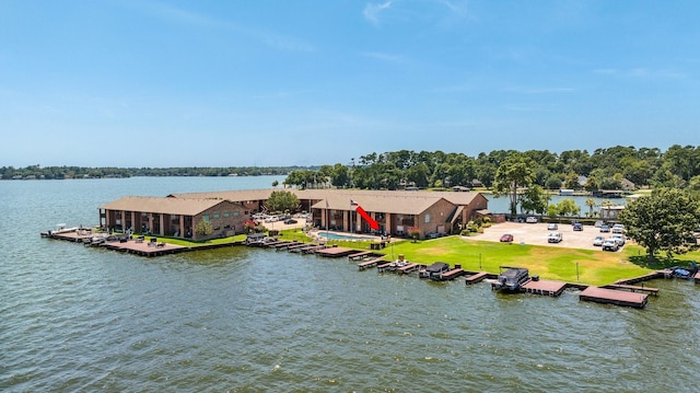 birds eye view of property with a water view