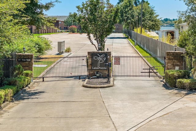 view of gate with fence