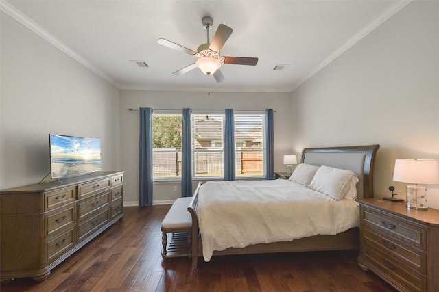 bedroom with dark wood-type flooring, visible vents, and ornamental molding