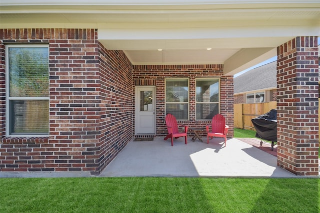 view of patio featuring fence