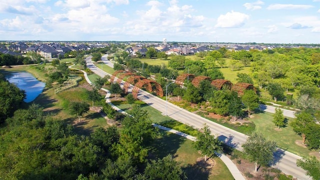 drone / aerial view with a residential view and a water view