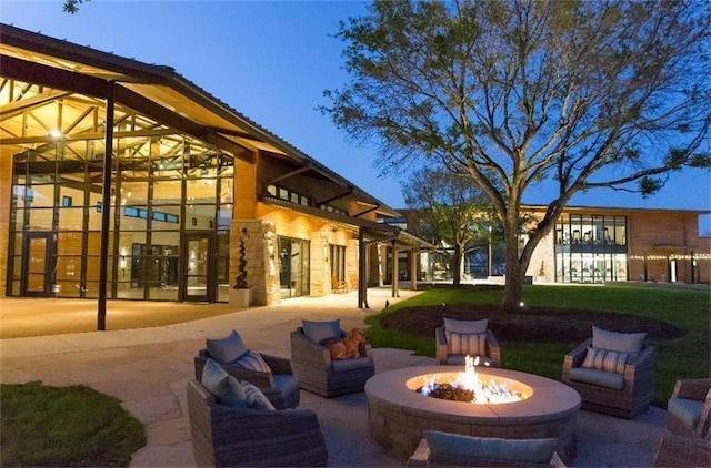 view of patio / terrace featuring an outdoor living space with a fire pit