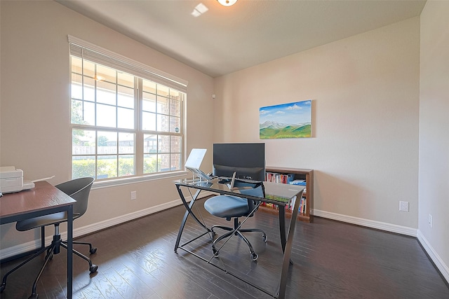 office space with dark wood-style floors and baseboards