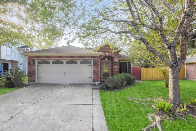 single story home featuring a garage, a front lawn, concrete driveway, and brick siding