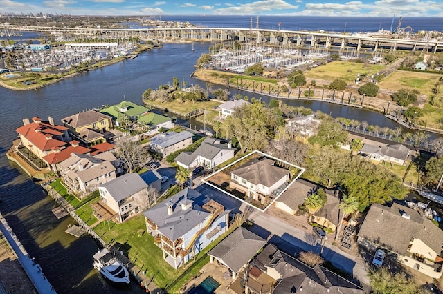 birds eye view of property featuring a residential view and a water view