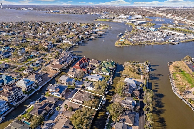 bird's eye view with a water view and a residential view