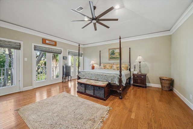 bedroom featuring baseboards, visible vents, ceiling fan, wood finished floors, and crown molding