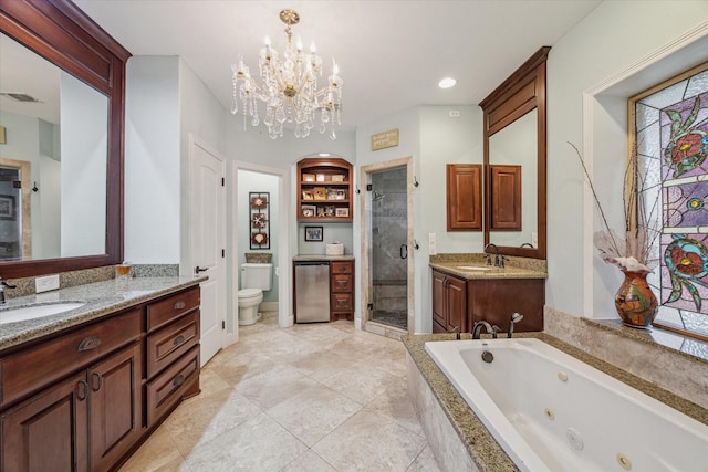 bathroom with visible vents, toilet, a jetted tub, vanity, and a shower stall