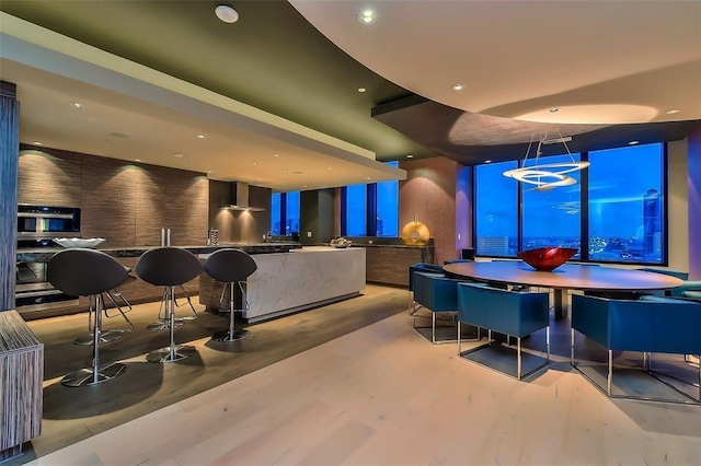 1409 Post Oak Unit 2503, Houston, TX 77056 - bar with recessed lighting, oven, and wood finished floors