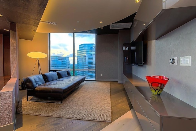 living room featuring expansive windows and wood finished floors