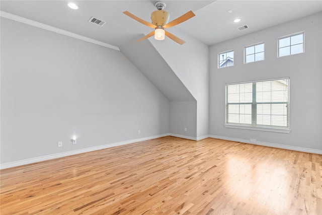 bonus room with visible vents, baseboards, and light wood finished floors