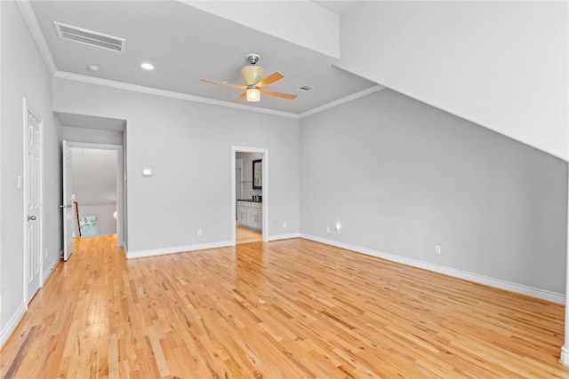 unfurnished bedroom with visible vents, baseboards, ornamental molding, and light wood finished floors