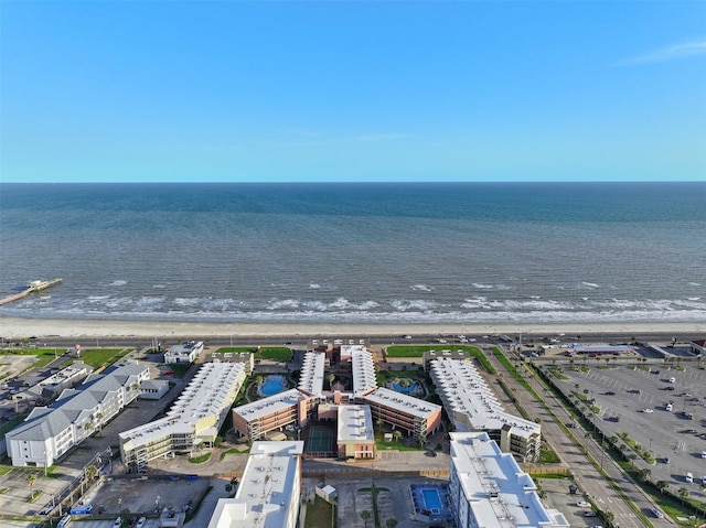 bird's eye view featuring a water view and a view of the beach